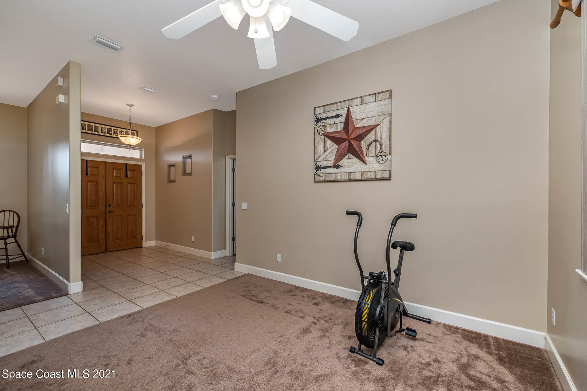 4329 Hunter Road Mims, FL 32754 - Photo 7 of 35 a view of a room with gym equipment