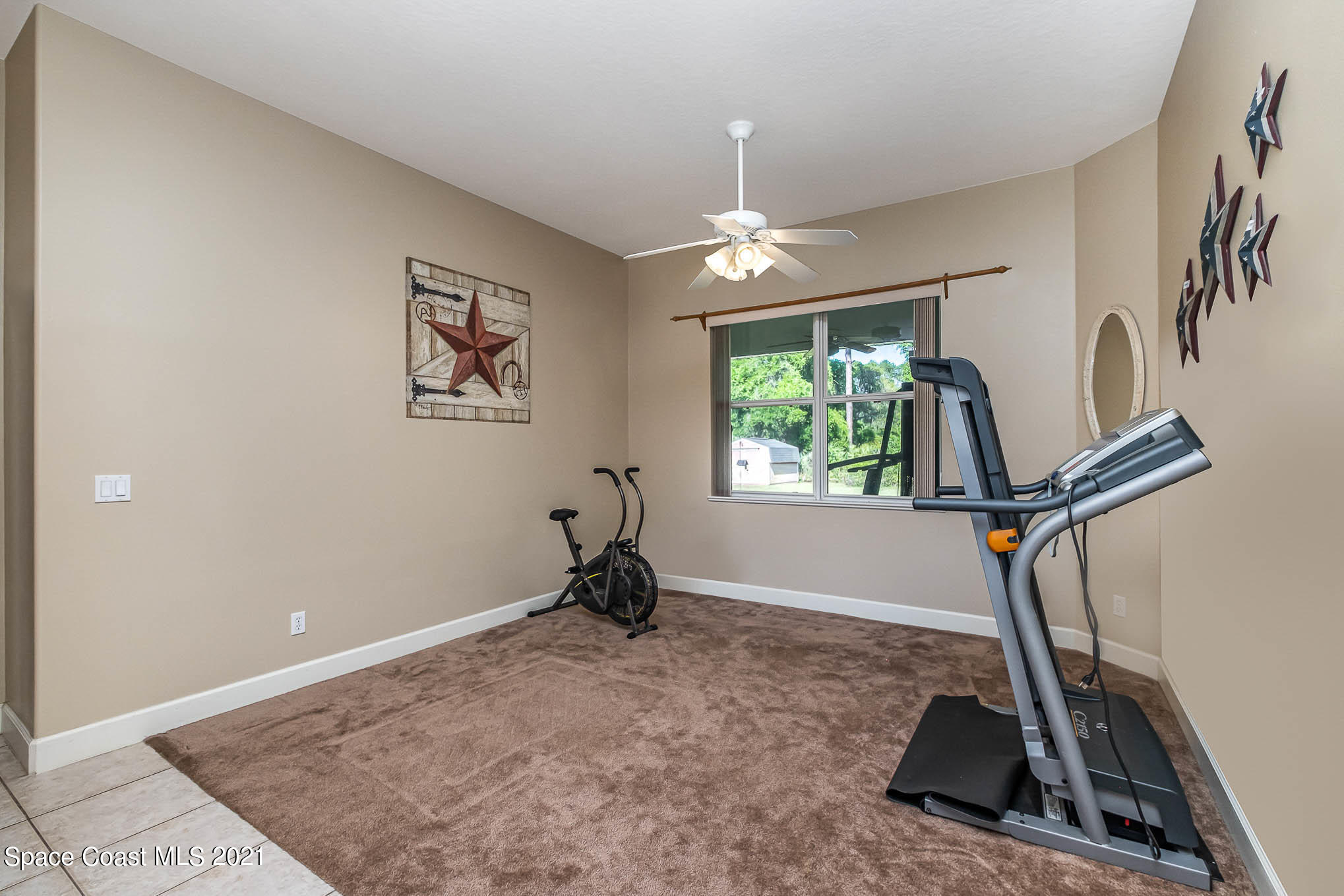 4329 Hunter Road Mims, FL 32754 - Photo 9 of 35 a view of a room with gym equipment