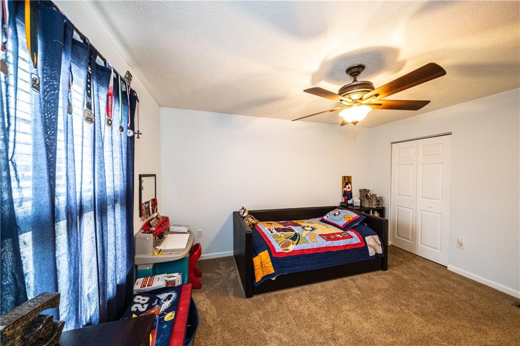 518 Blue Ridge Drive Coraopolis, PA 15108 - Photo 12 of 25 Upper bedroom with closet and ceiling fan.