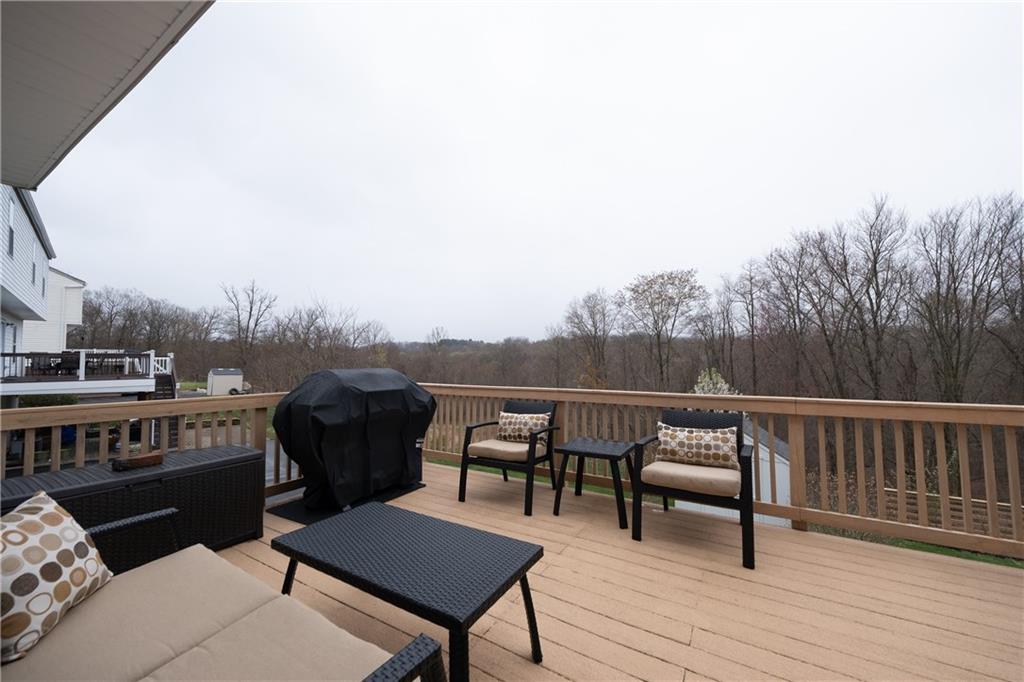 518 Blue Ridge Drive Coraopolis, PA 15108 - Photo 21 of 25 Upper Deck, walks out from kitchen over looks treed landscaping.