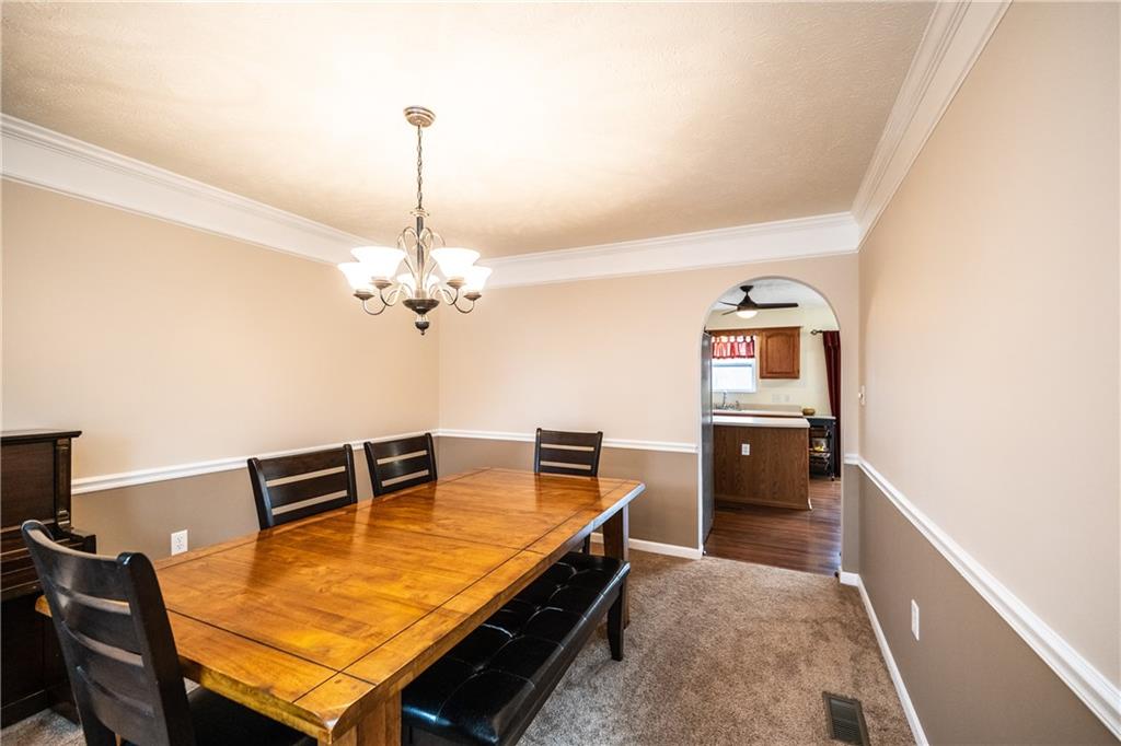 518 Blue Ridge Drive Coraopolis, PA 15108 - Photo 6 of 25 Formal Dining room with crown molding and chair rail off kitchen.
