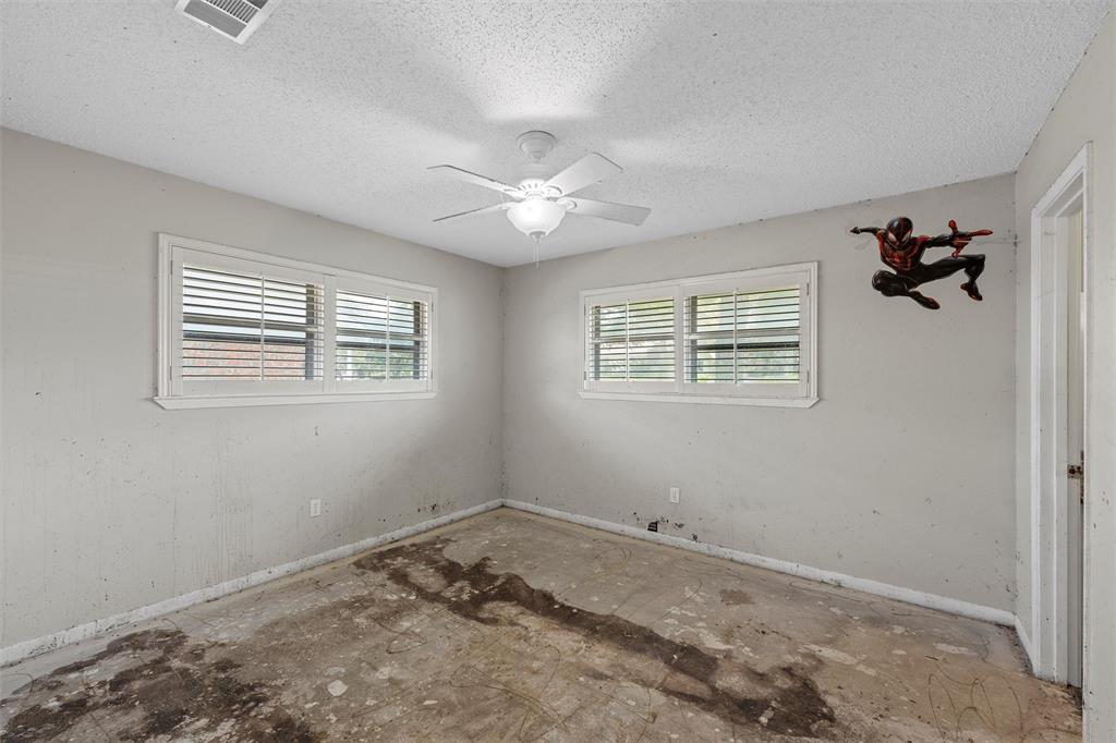 849 Deer Ridge Drive Woodway, TX 76712 - Photo 13 of 25 a view of a room with a window and a ceiling fan