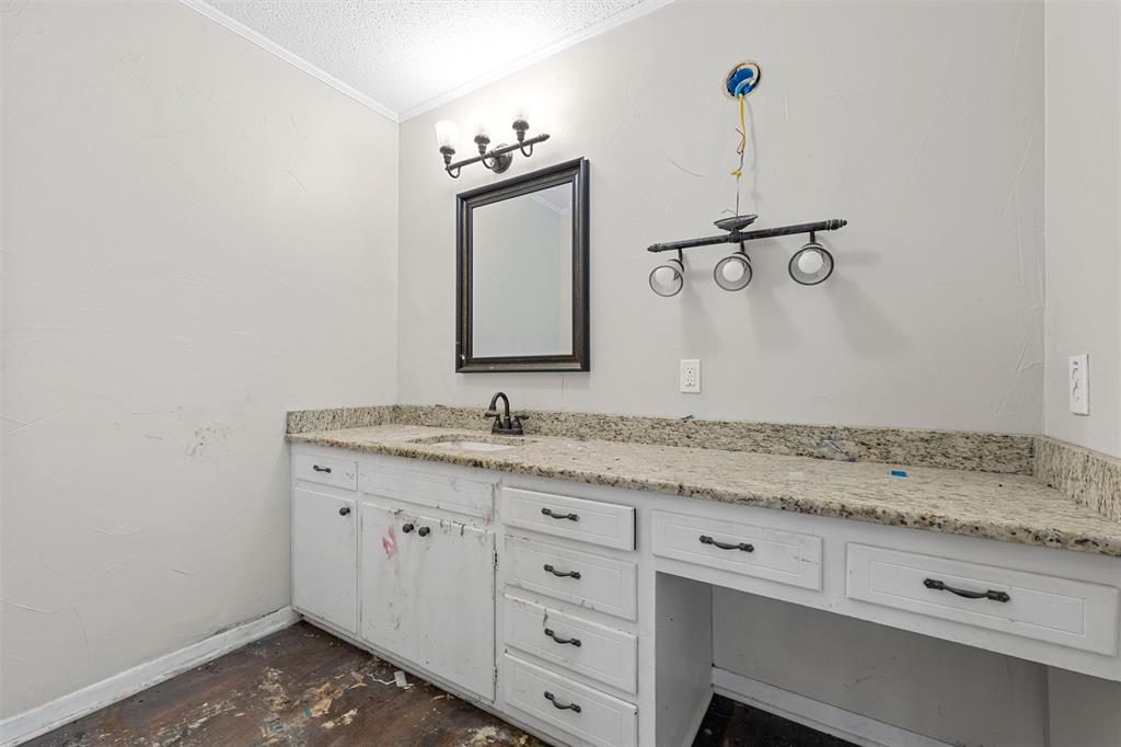 849 Deer Ridge Drive Woodway, TX 76712 - Photo 16 of 25 a bathroom with a granite countertop sink and a mirror