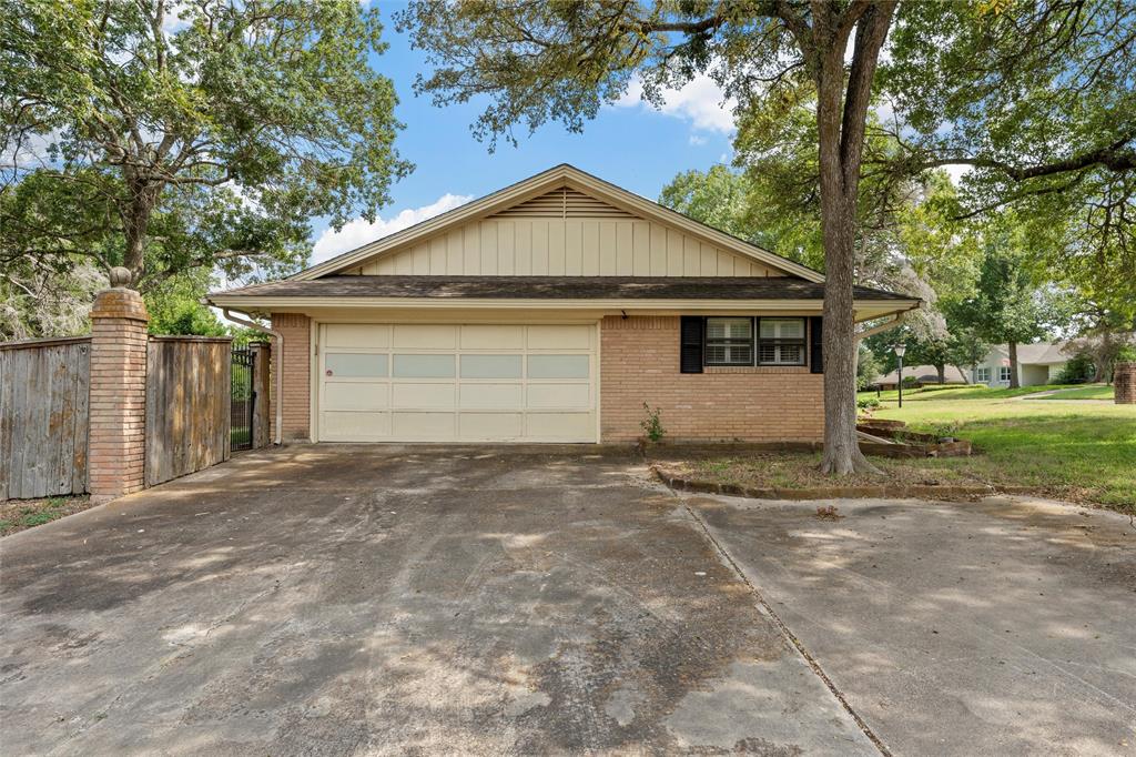 849 Deer Ridge Drive Woodway, TX 76712 - Photo 2 of 25 a view of garage yard and tree