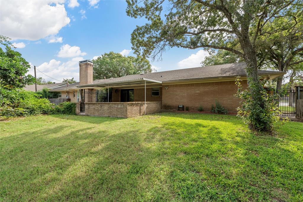 849 Deer Ridge Drive Woodway, TX 76712 - Photo 22 of 25 a view of a house with backyard and garden