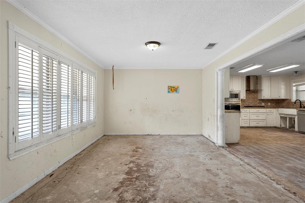 849 Deer Ridge Drive Woodway, TX 76712 - Photo 5 of 25 a view of a kitchen with a sink and dishwasher a stove top oven with wooden floor