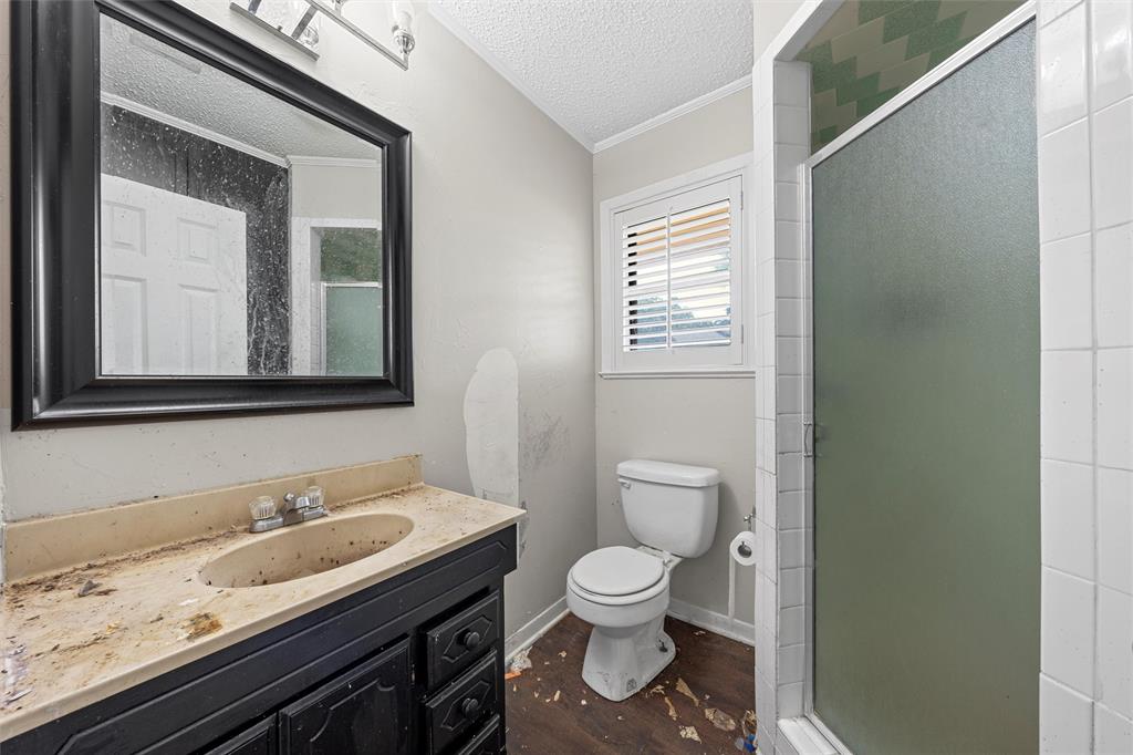 849 Deer Ridge Drive Woodway, TX 76712 - Photo 10 of 25 a bathroom with a granite countertop toilet sink and mirror