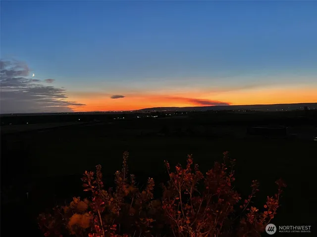 a view of sunset and a city