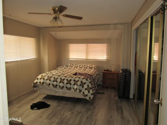 a bathroom with a black and white checkered floor