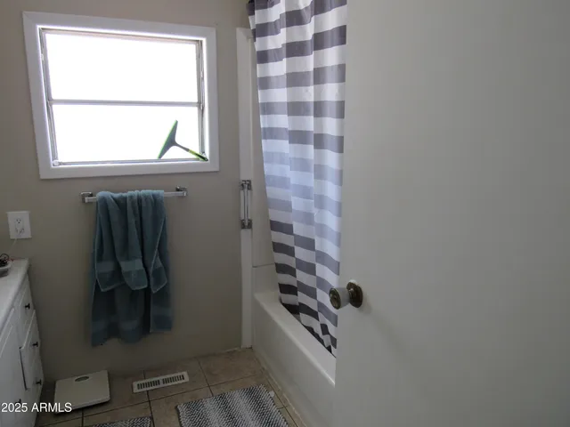 a view of a backyard house and swimming pool