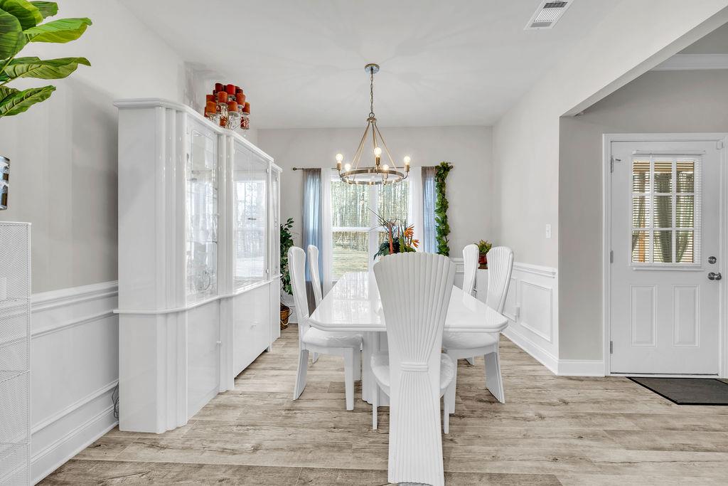 814 Natures Walk Gray, GA 31032 - Photo 15 of 27 a view of a dining room with furniture window and wooden floor