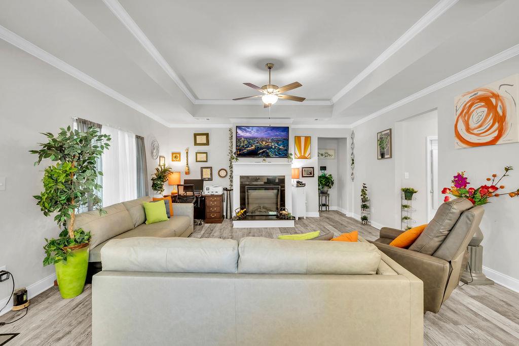 814 Natures Walk Gray, GA 31032 - Photo 19 of 27 a living room with furniture flower pot and a fireplace