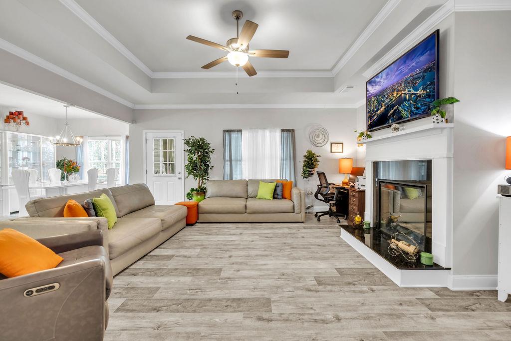 814 Natures Walk Gray, GA 31032 - Photo 20 of 27 a living room with furniture a fireplace and a flat screen tv
