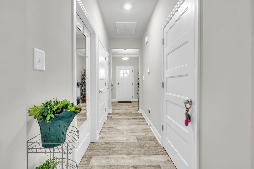 814 Natures Walk Gray, GA 31032 - Photo 2 of 27 a view of a hallway with wooden floor