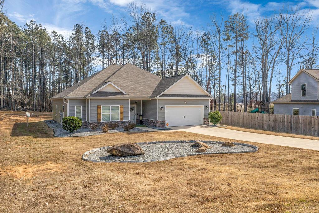 814 Natures Walk Gray, GA 31032 - Photo 9 of 27 a front view of a house with a yard and garage