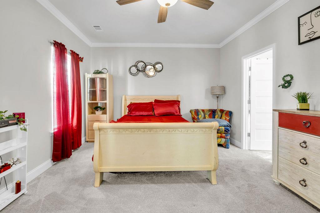 814 Natures Walk Gray, GA 31032 - Photo 10 of 27 a bed room with a bed and a dresser