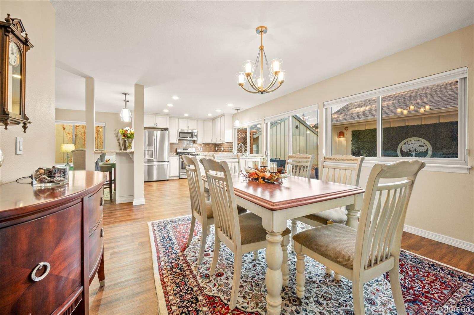 8734 Independence Way Arvada, CO 80005 - Photo 14 of 50 a view of a dining room with furniture