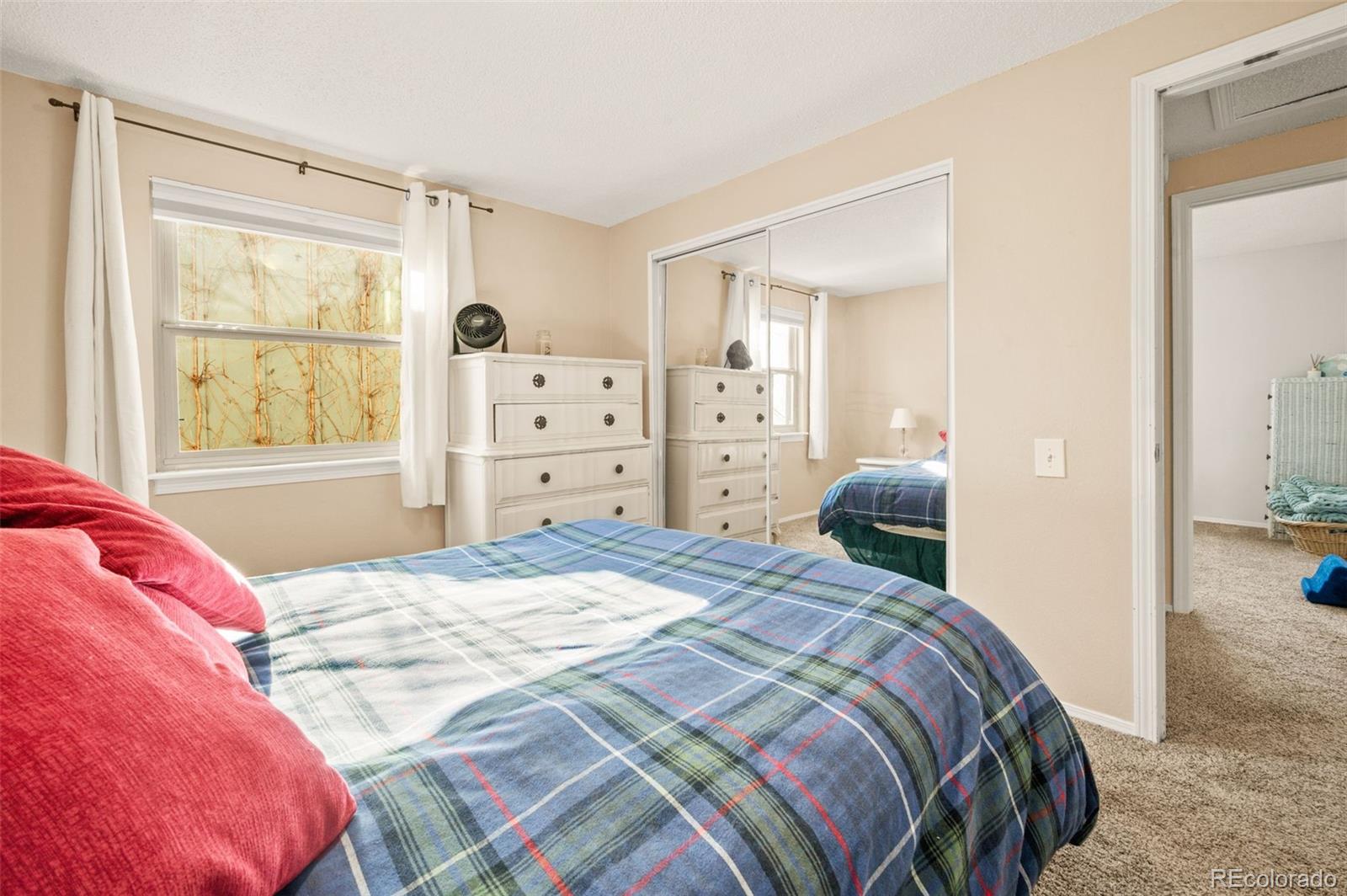 8734 Independence Way Arvada, CO 80005 - Photo 27 of 50 a bedroom with a bed and wooden floor