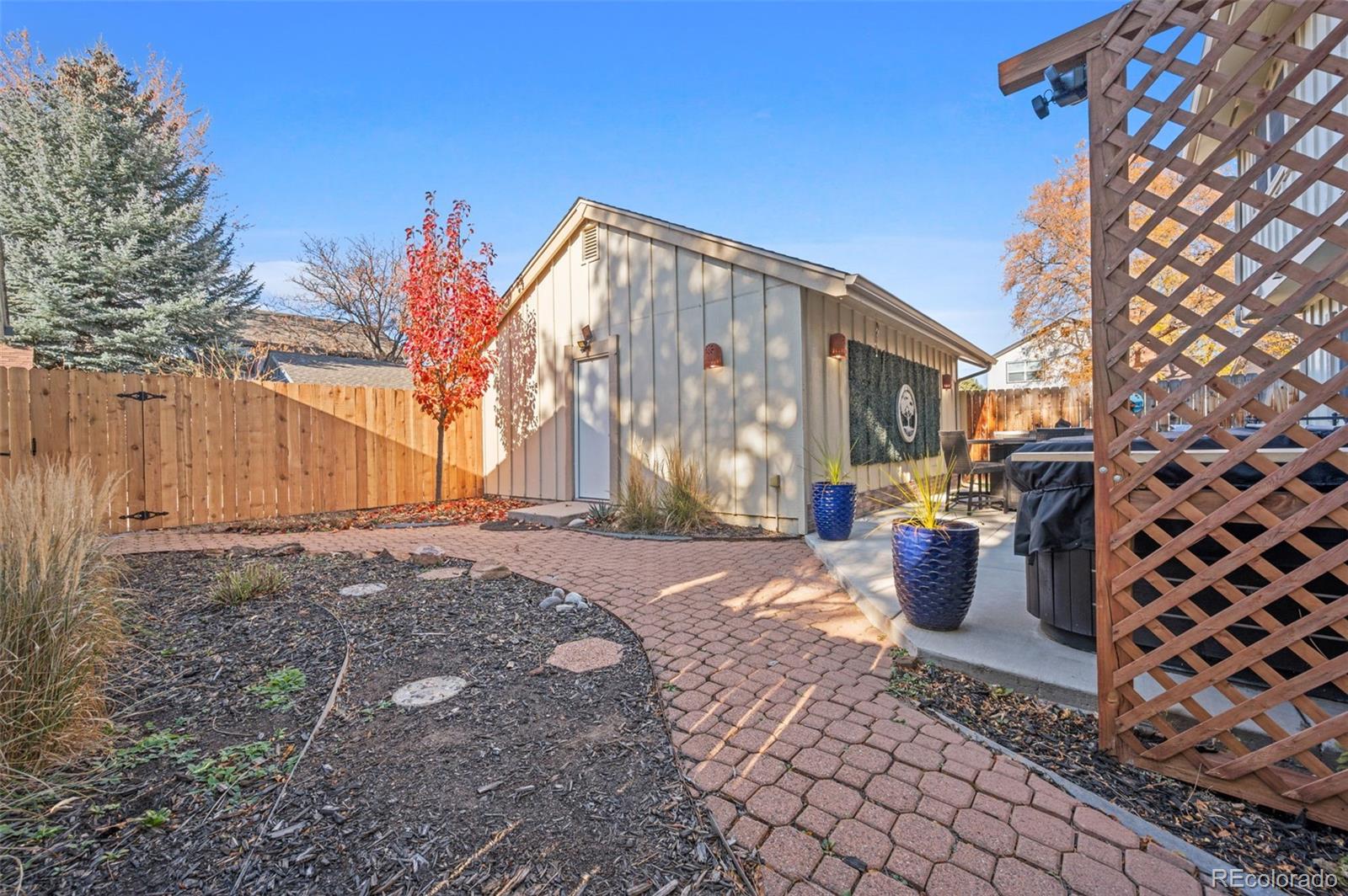 8734 Independence Way Arvada, CO 80005 - Photo 28 of 50 a view of a back yard of the house