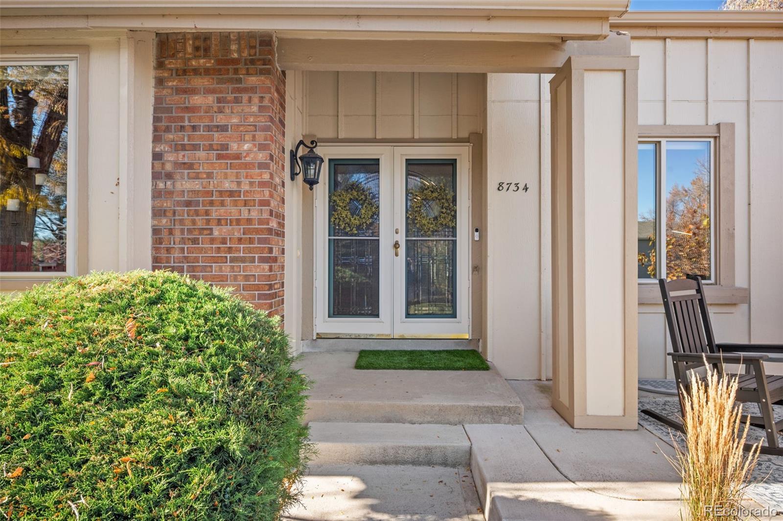 8734 Independence Way Arvada, CO 80005 - Photo 3 of 50 a front view of a house with a yard