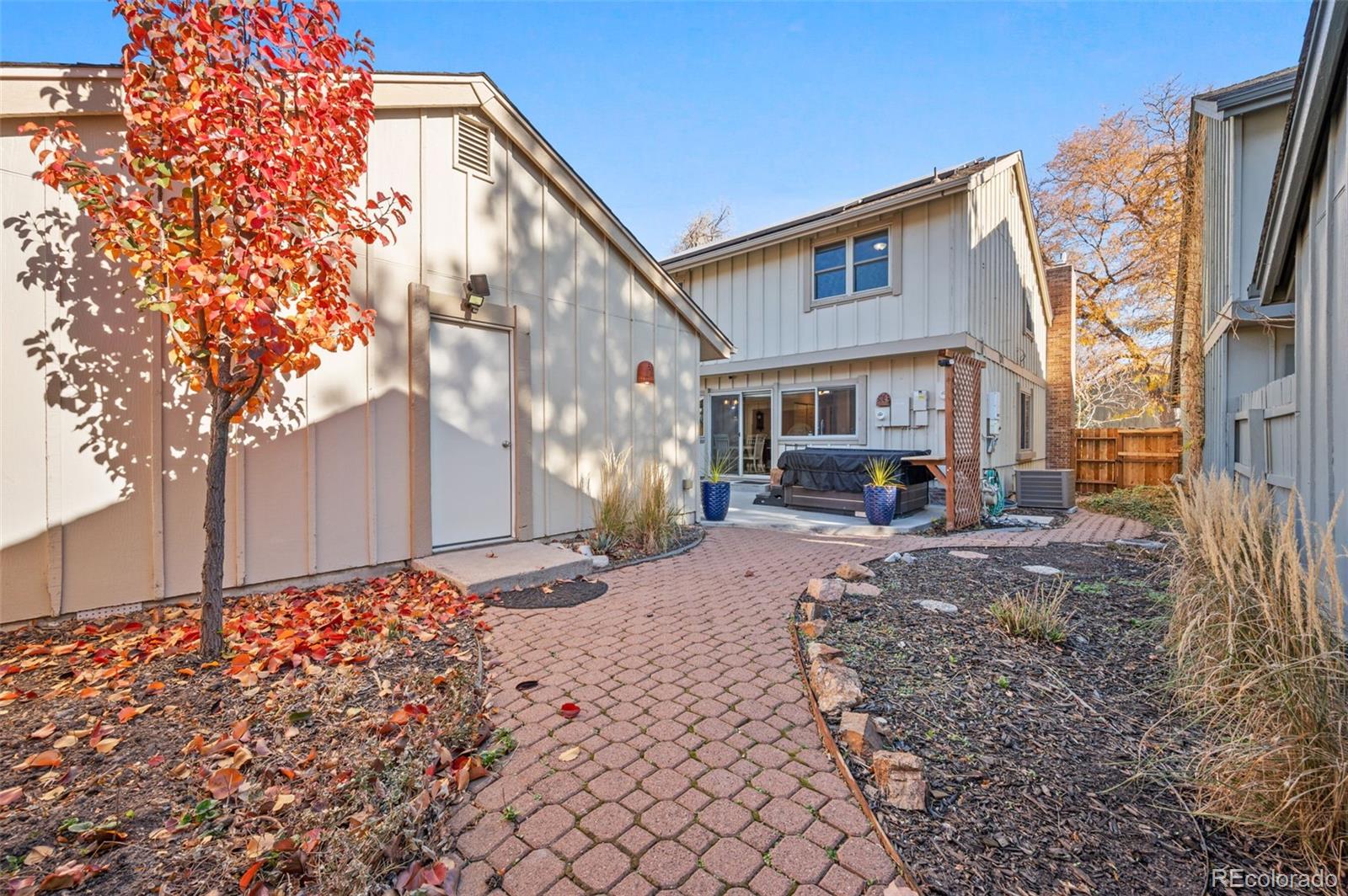 8734 Independence Way Arvada, CO 80005 - Photo 44 of 50 a front view of a house with garden
