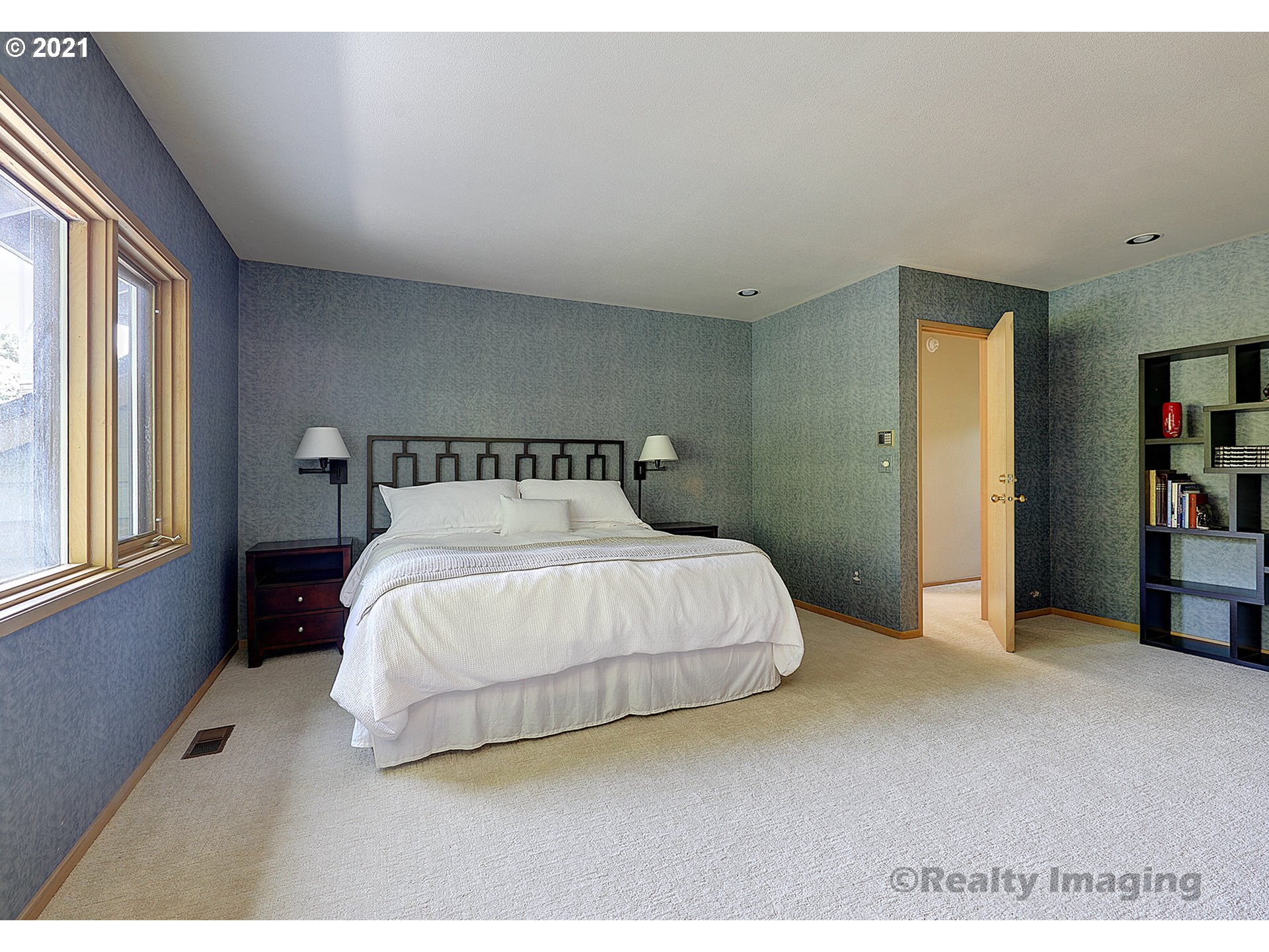 7402 Northwest Penridge Road Portland, OR 97229 - Photo 15 of 32 a bedroom with a bed and window