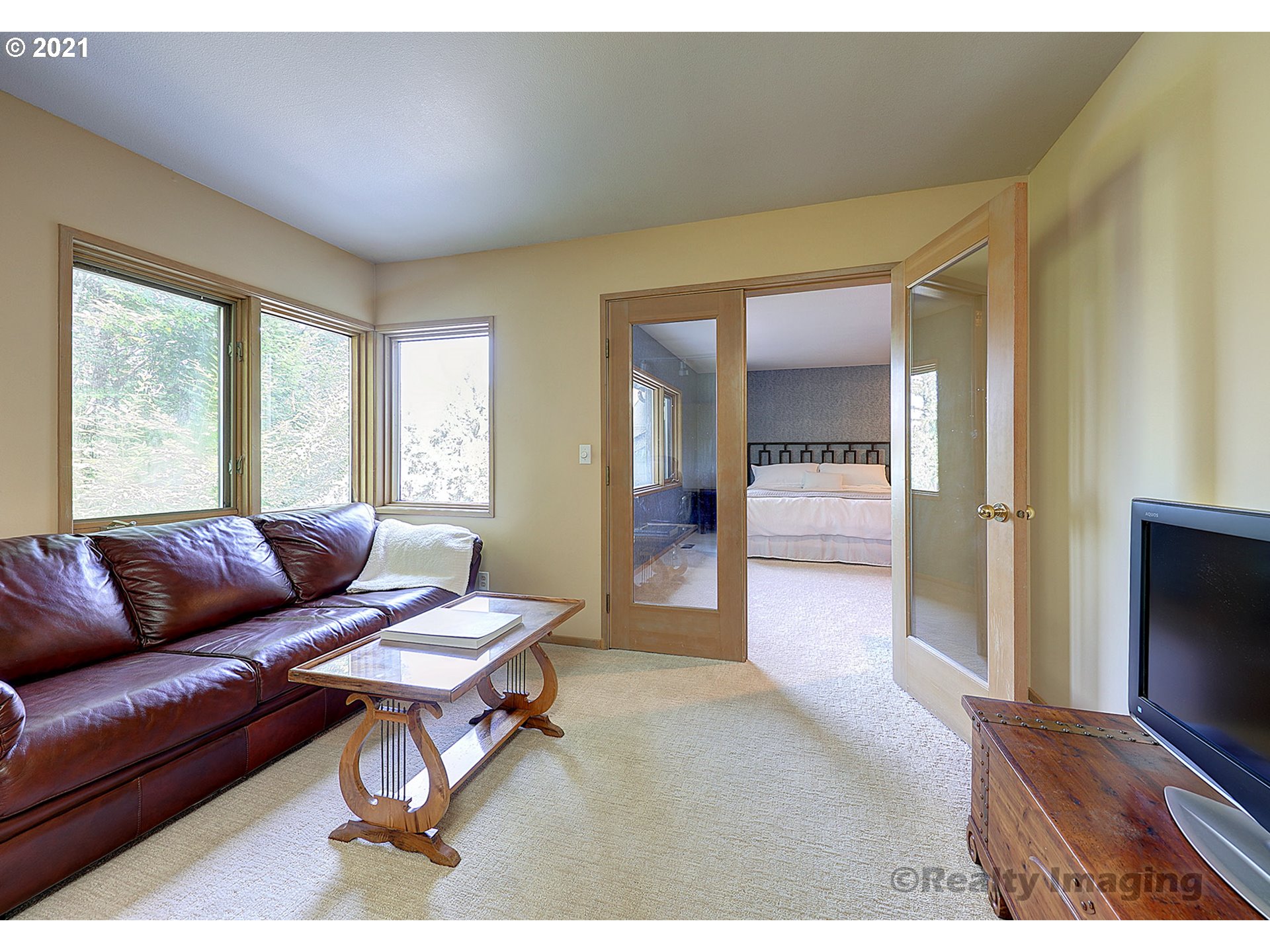 7402 Northwest Penridge Road Portland, OR 97229 - Photo 16 of 32 a living room with furniture and a flat screen tv