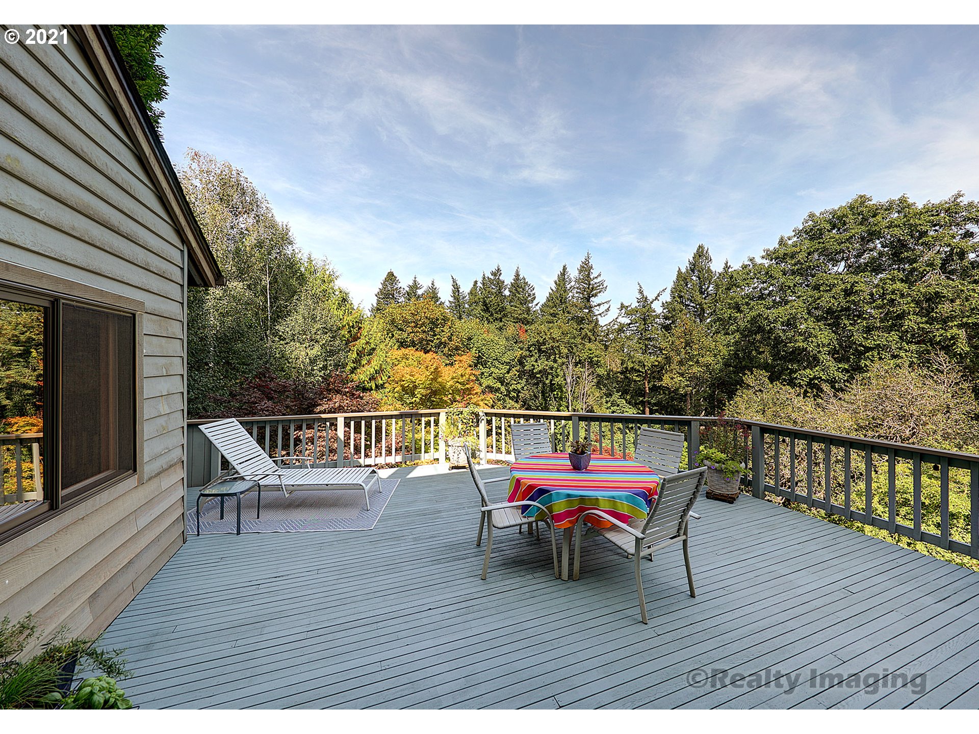 7402 Northwest Penridge Road Portland, OR 97229 - Photo 22 of 32 a wooden bench sitting on top of a wooden deck