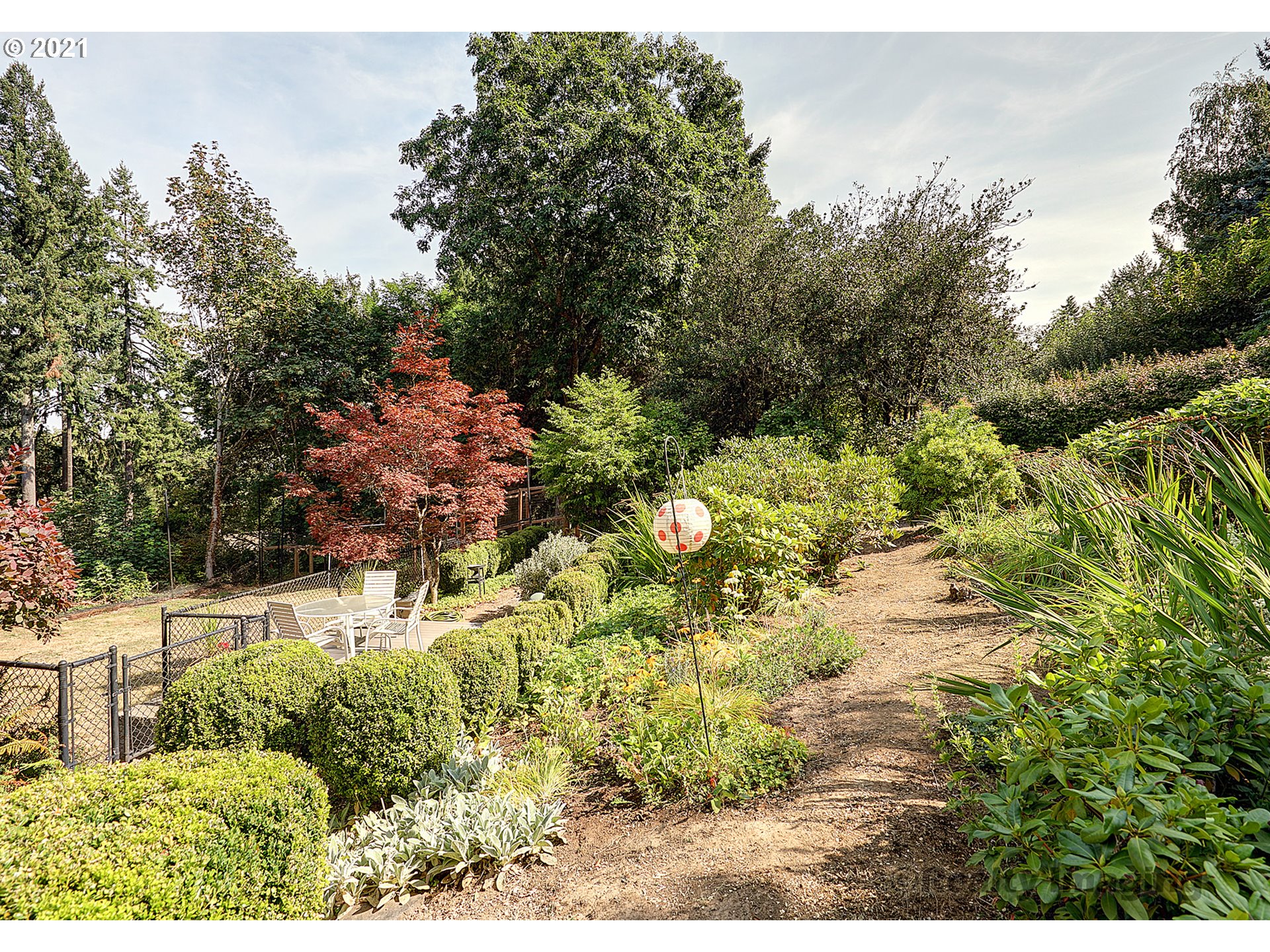 7402 Northwest Penridge Road Portland, OR 97229 - Photo 27 of 32 a view of a yard with plants