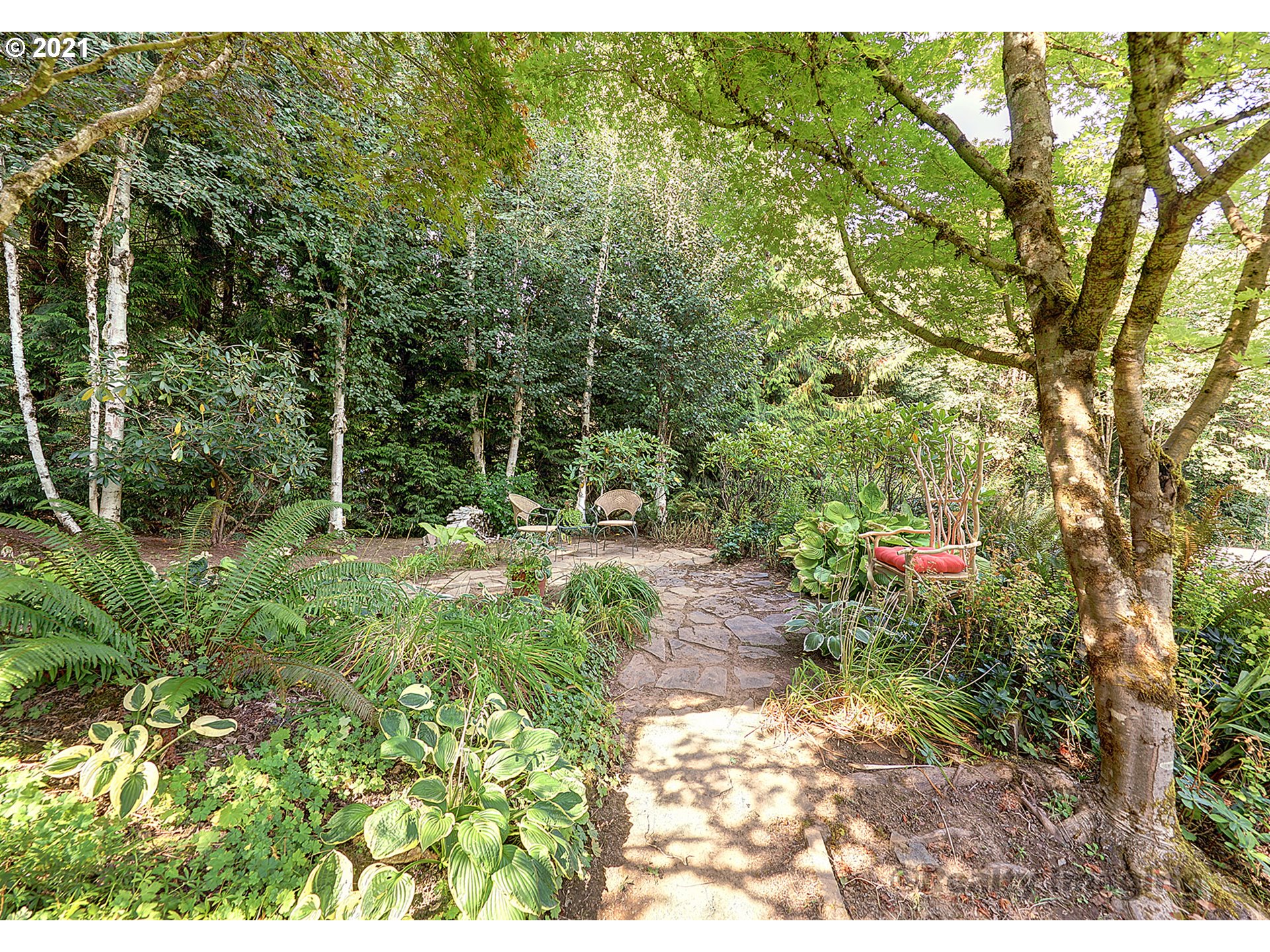 7402 Northwest Penridge Road Portland, OR 97229 - Photo 29 of 32 a backyard of a house with lots of green space
