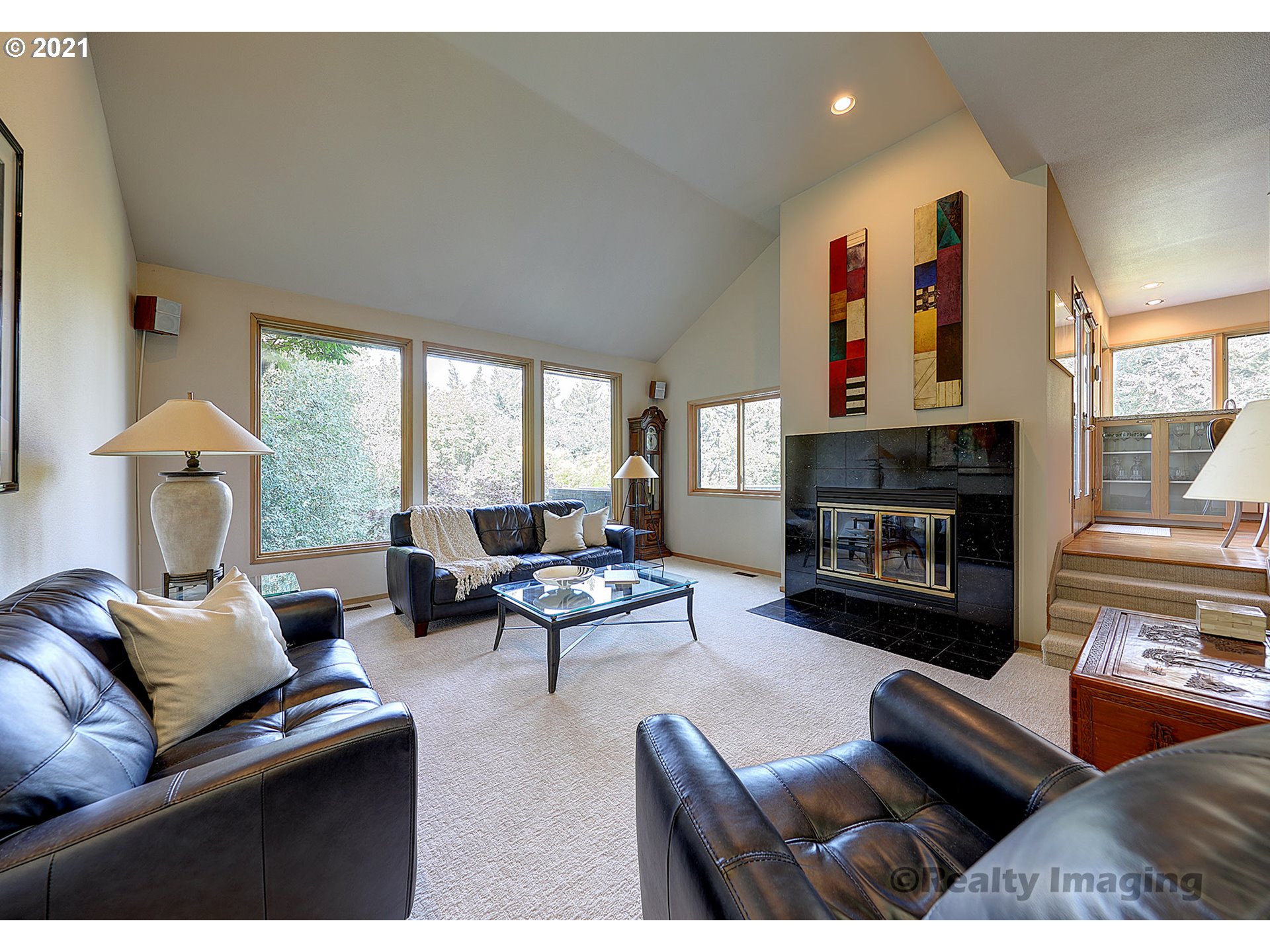 7402 Northwest Penridge Road Portland, OR 97229 - Photo 3 of 32 a living room with furniture fireplace and a large window