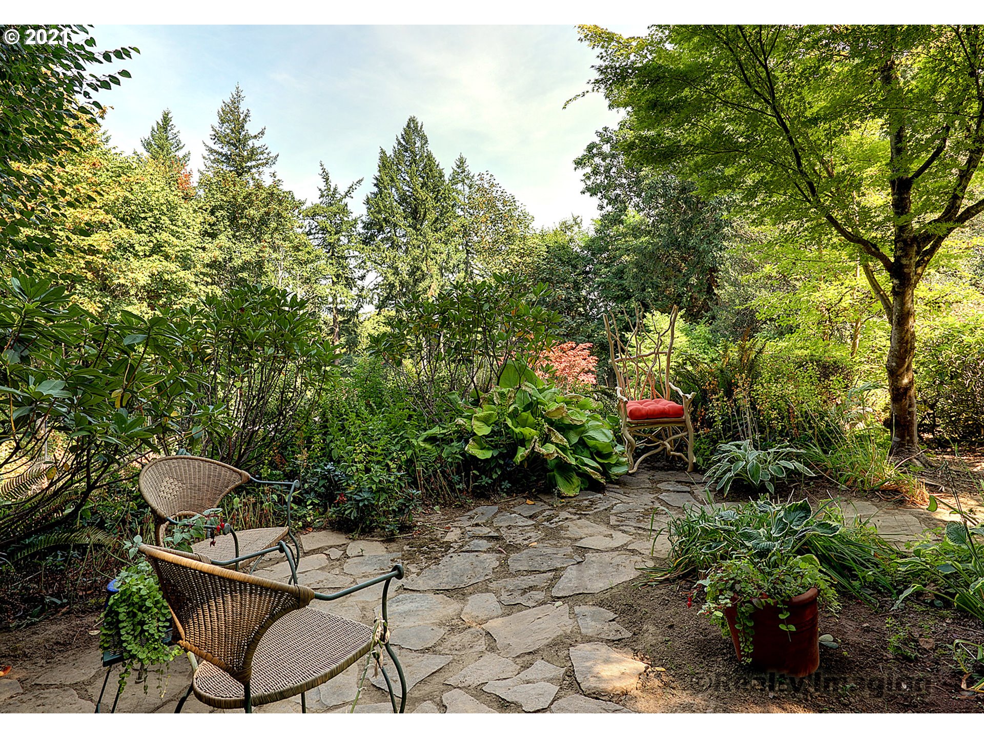 7402 Northwest Penridge Road Portland, OR 97229 - Photo 31 of 32 a view of a backyard with sitting area