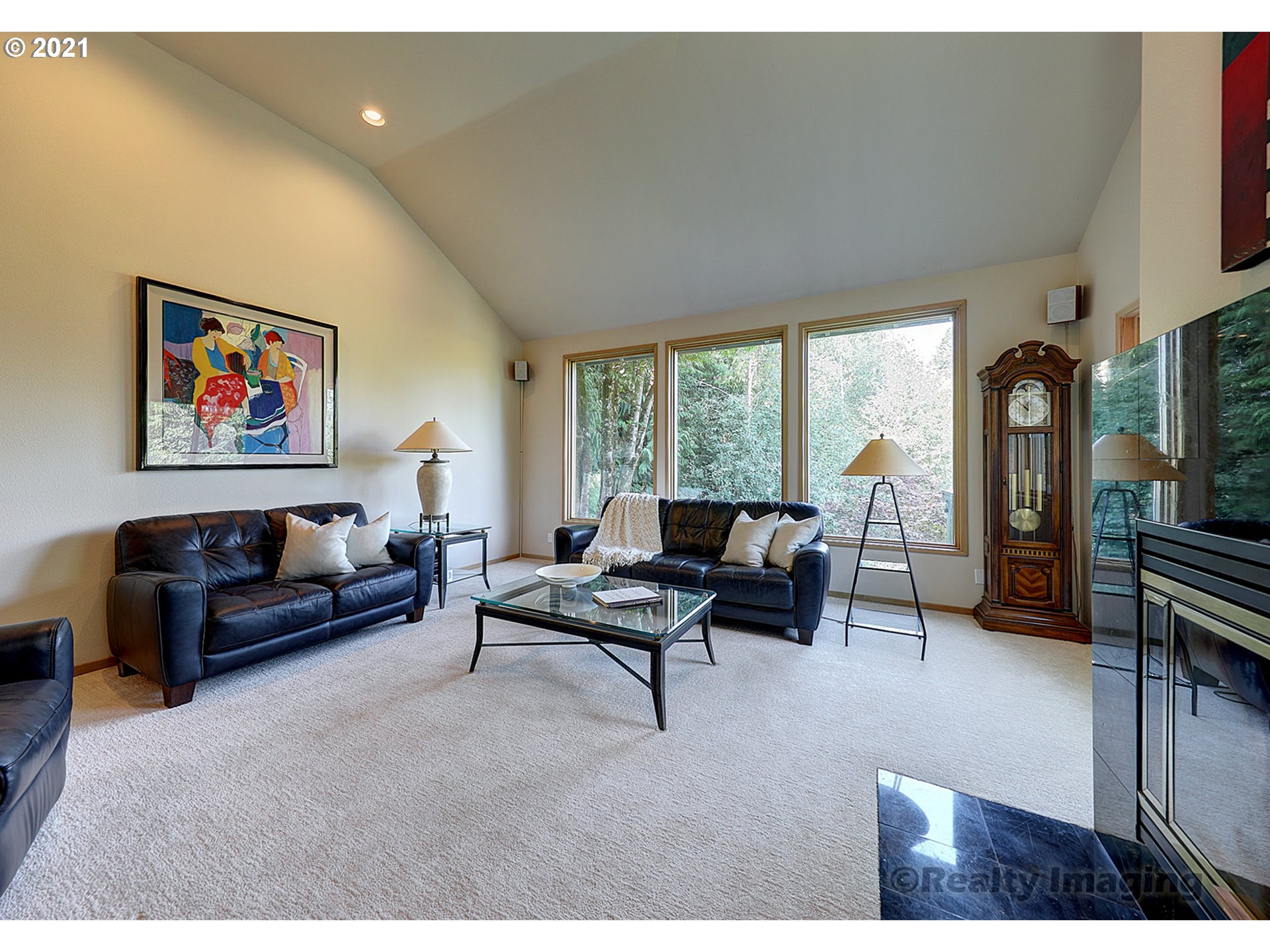 7402 Northwest Penridge Road Portland, OR 97229 - Photo 4 of 32 a living room with furniture and a floor to ceiling window