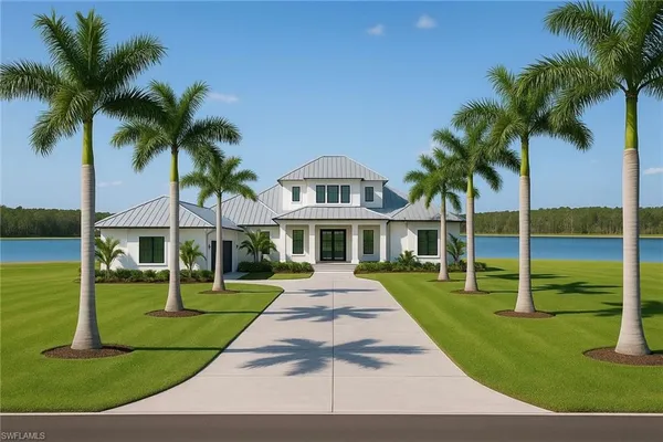 a front view of a house with a yard and palm trees