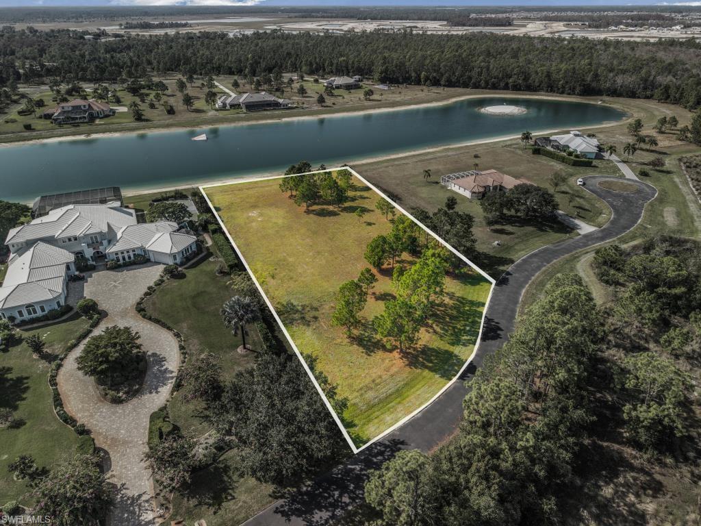 20200 Slalom Course Court Estero, FL 33928 - Photo 12 of 20 an aerial view of a house with a lake view