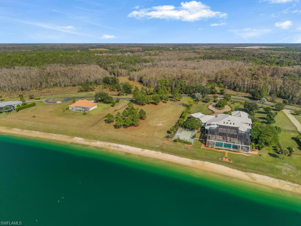 20200 Slalom Course Court Estero, FL 33928 - Photo 5 of 20 a view of a lake with houses