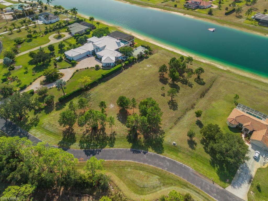 20200 Slalom Course Court Estero, FL 33928 - Photo 7 of 20 an aerial view of swimming pool with a yard