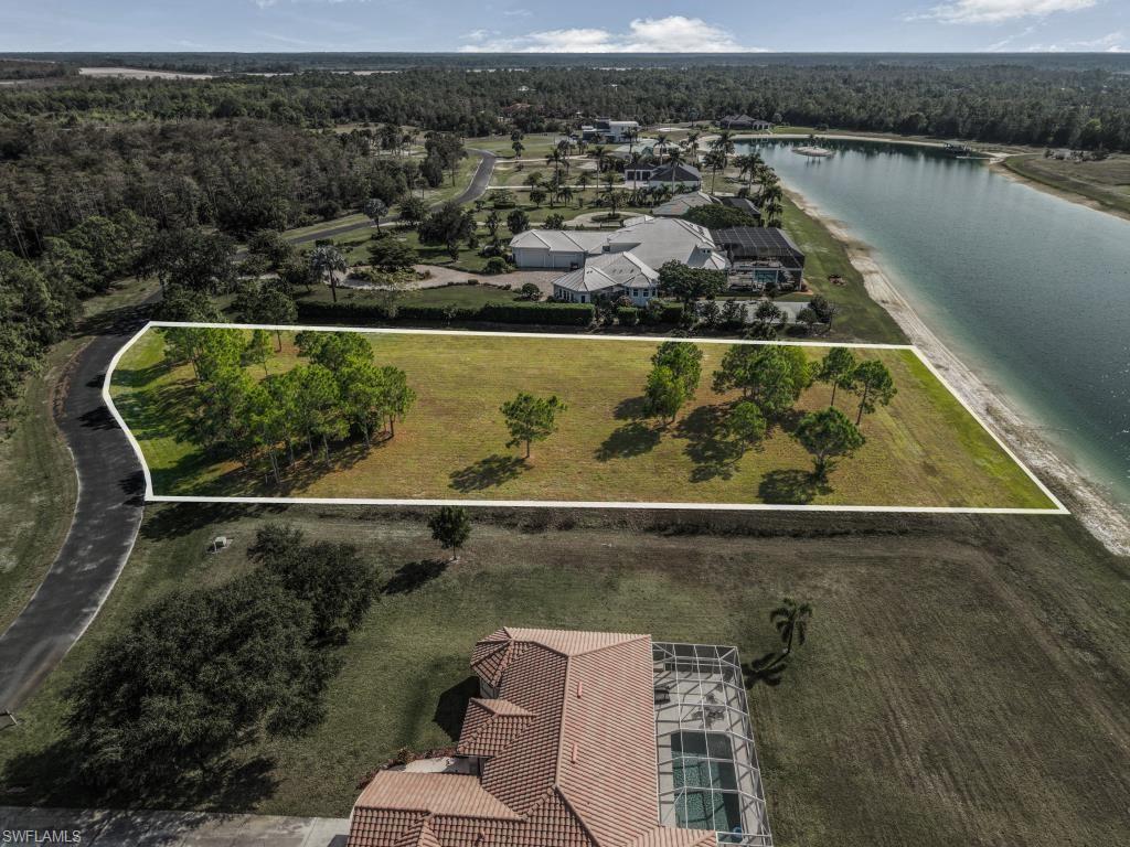 20200 Slalom Course Court Estero, FL 33928 - Photo 9 of 20 an aerial view of a residential houses with outdoor space and ocean view