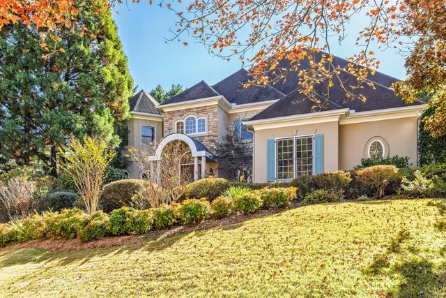 a front view of a house with a yard