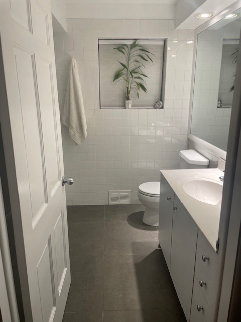 5955 North Keating Avenue Chicago, IL 60646 - Photo 12 of 22 a bathroom with a sink and a mirror