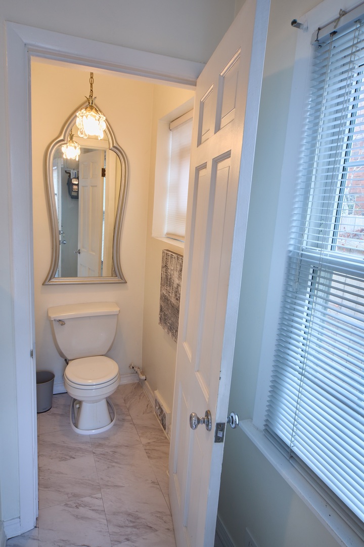 5955 North Keating Avenue Chicago, IL 60646 - Photo 13 of 22 a bathroom with a toilet and a shower