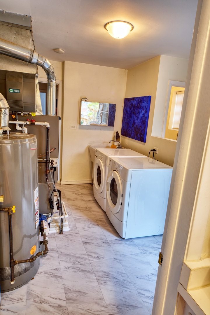 5955 North Keating Avenue Chicago, IL 60646 - Photo 14 of 22 a utility room with dryer washer and a view of living room