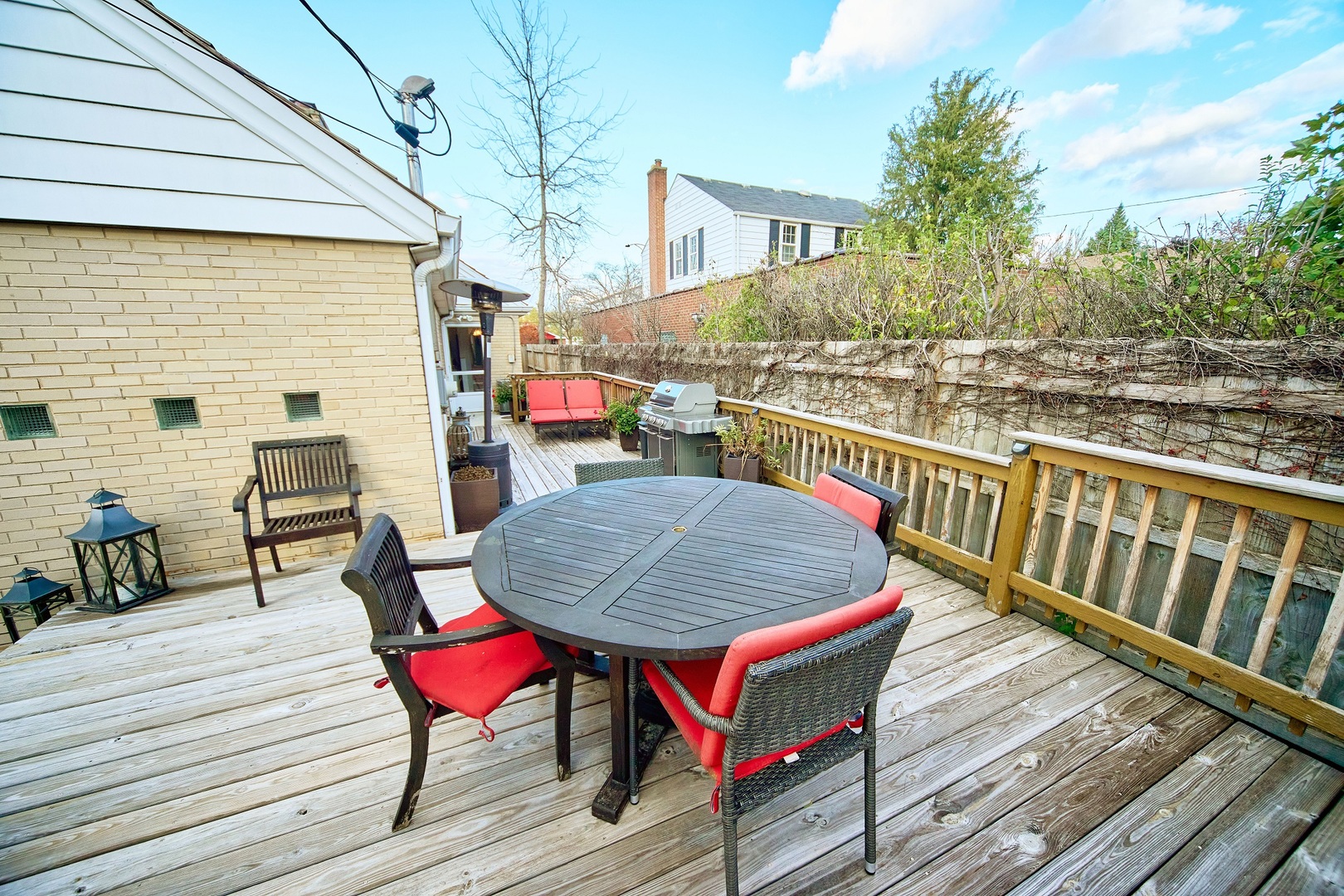5955 North Keating Avenue Chicago, IL 60646 - Photo 18 of 22 a balcony with wooden floor table and chairs