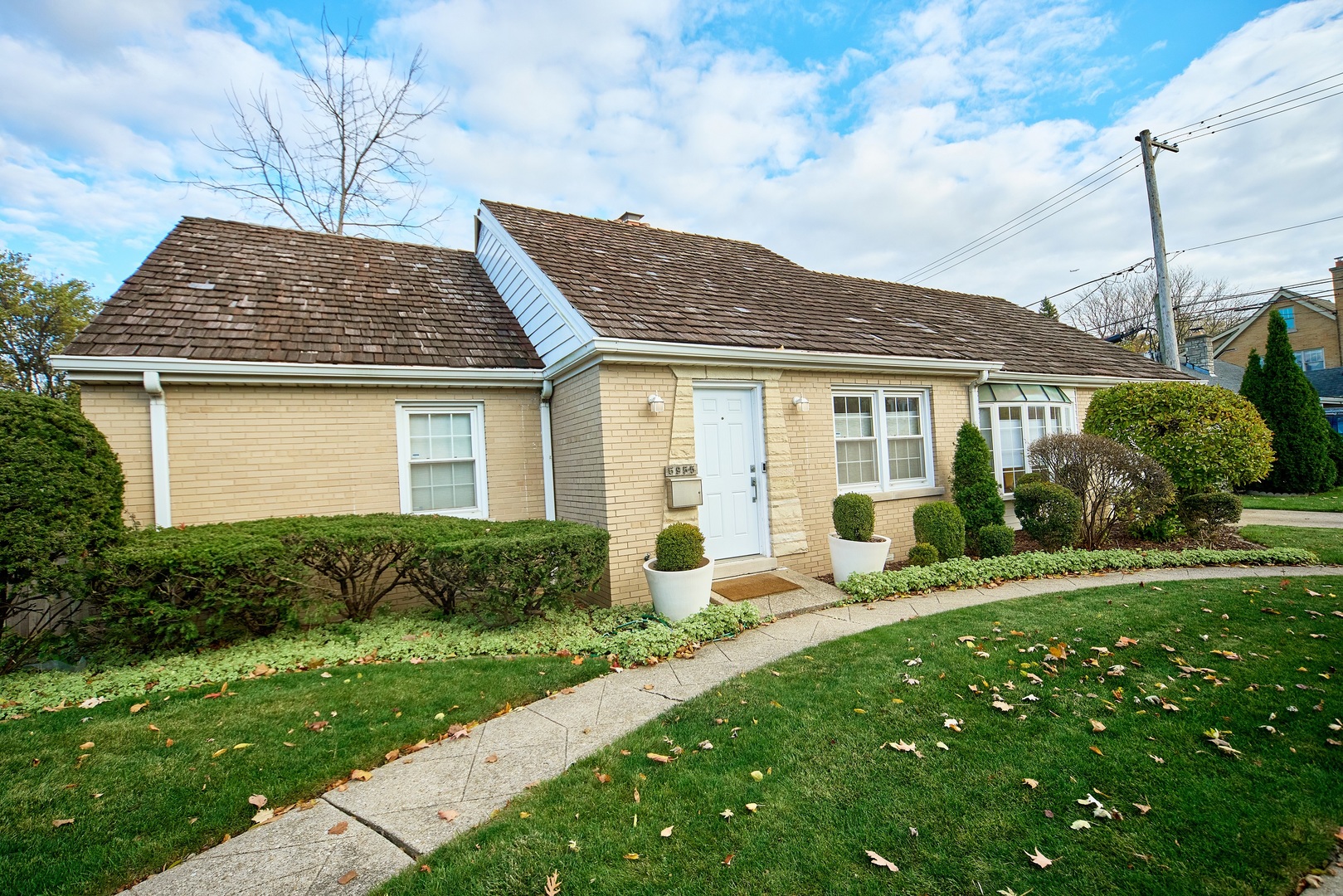 5955 North Keating Avenue Chicago, IL 60646 - Photo 2 of 22 a front view of house with yard and green space