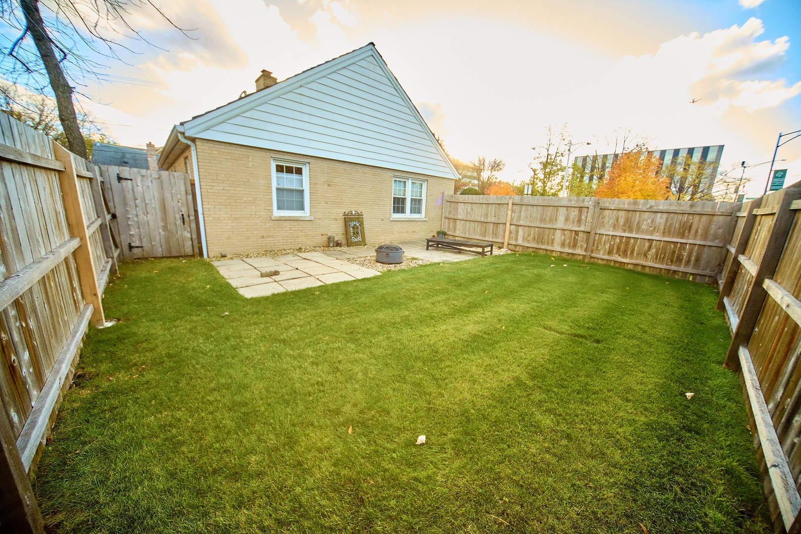 5955 North Keating Avenue Chicago, IL 60646 - Photo 21 of 22 a view of a house with backyard and sitting area