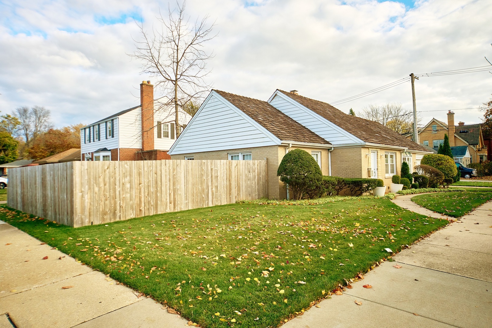5955 North Keating Avenue Chicago, IL 60646 - Photo 3 of 22 a front view of a house with garden