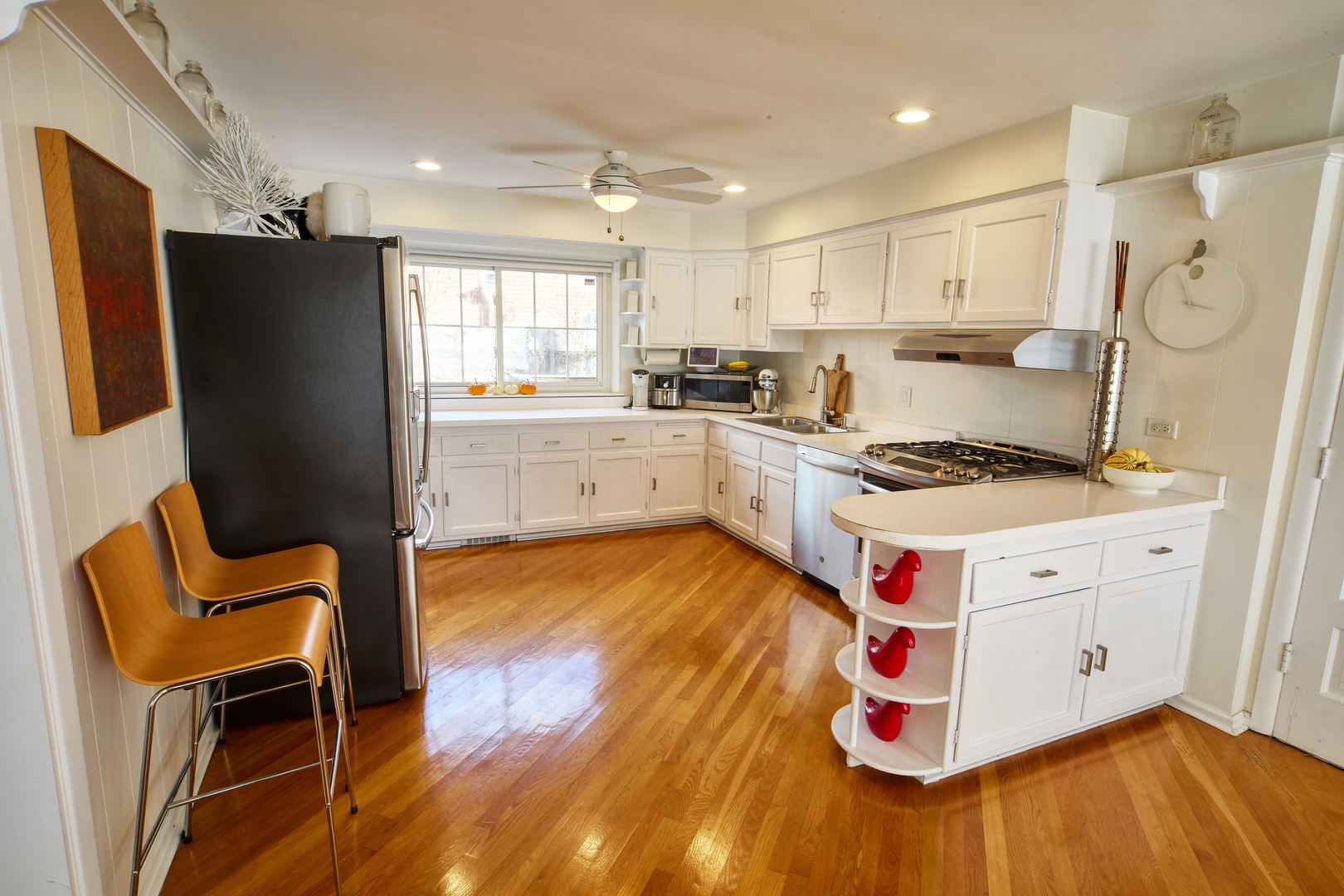 5955 North Keating Avenue Chicago, IL 60646 - Photo 7 of 22 a kitchen with stainless steel appliances granite countertop a stove and a refrigerator