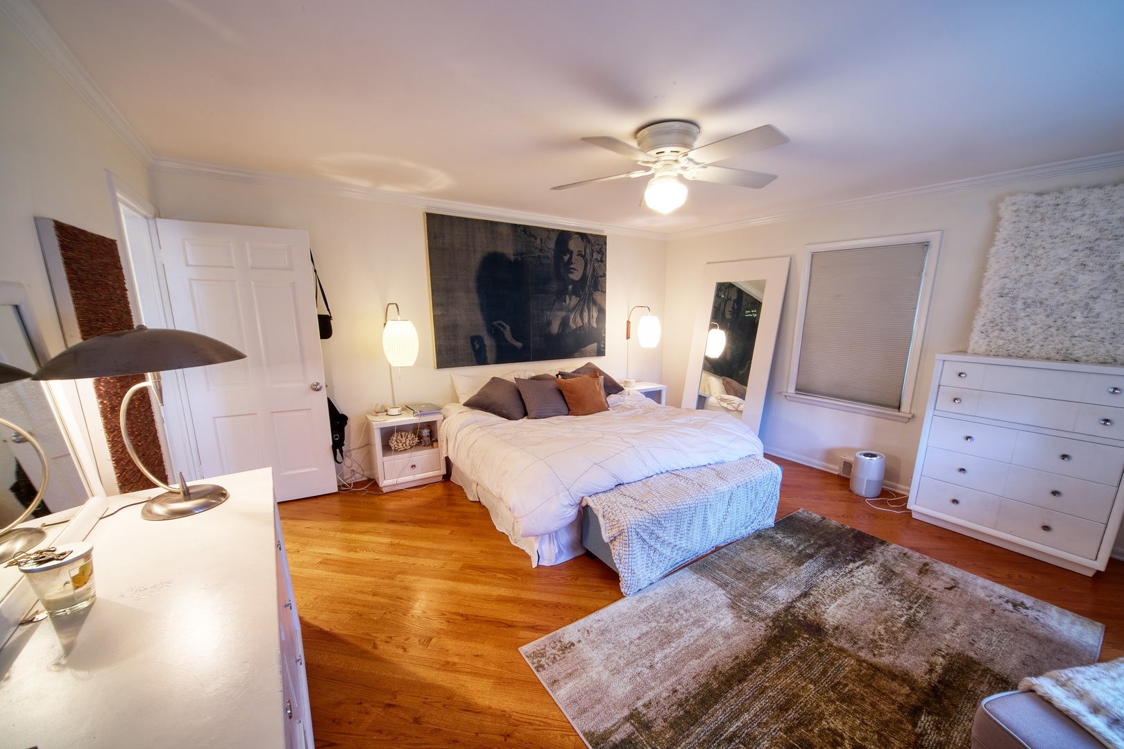 5955 North Keating Avenue Chicago, IL 60646 - Photo 10 of 22 a bedroom with a bed and flat screen tv