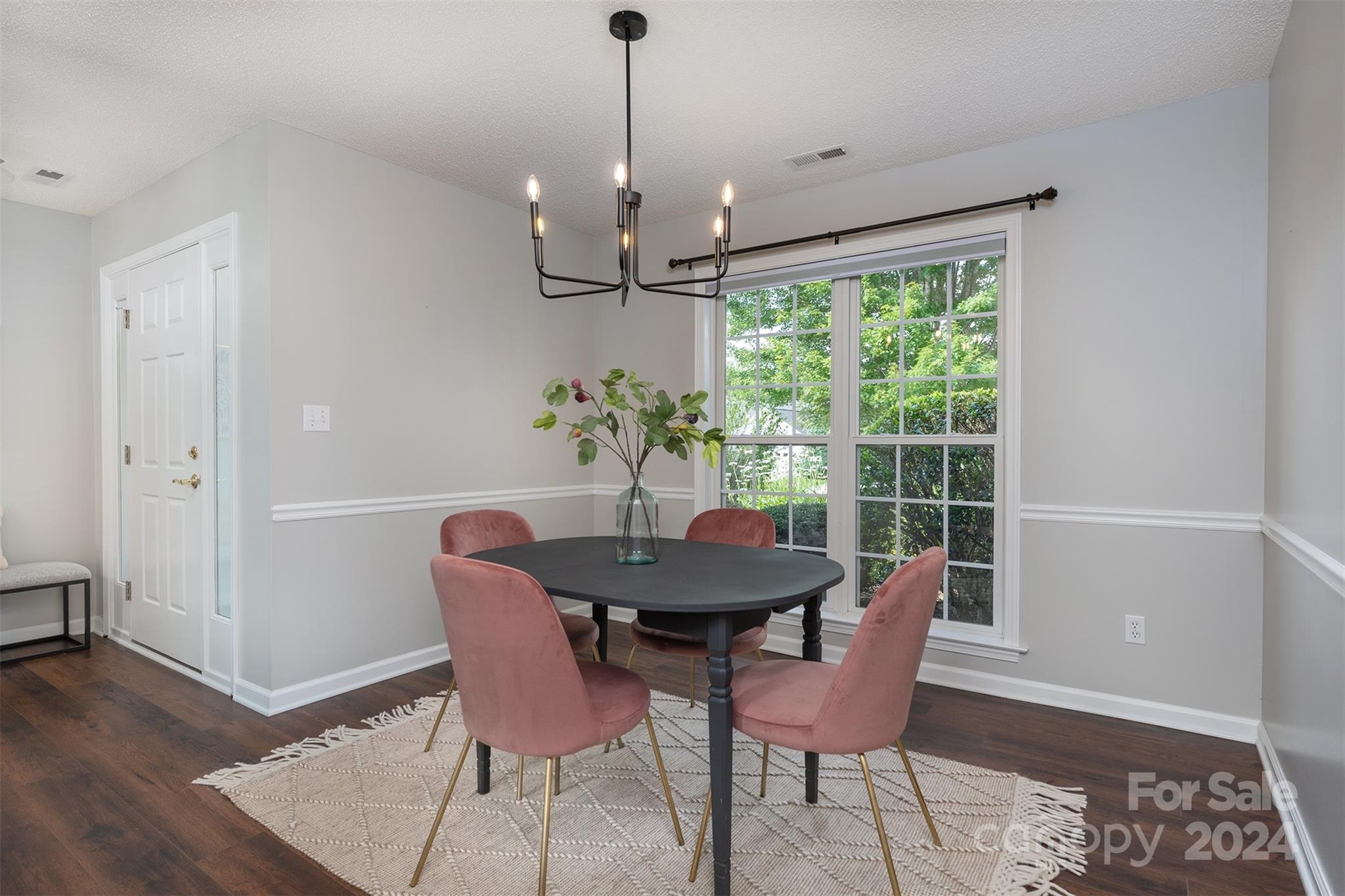 311 Planters Creek Road Fletcher, NC 28732 - Photo 11 of 24 a view of a dining room with furniture window and wooden floor