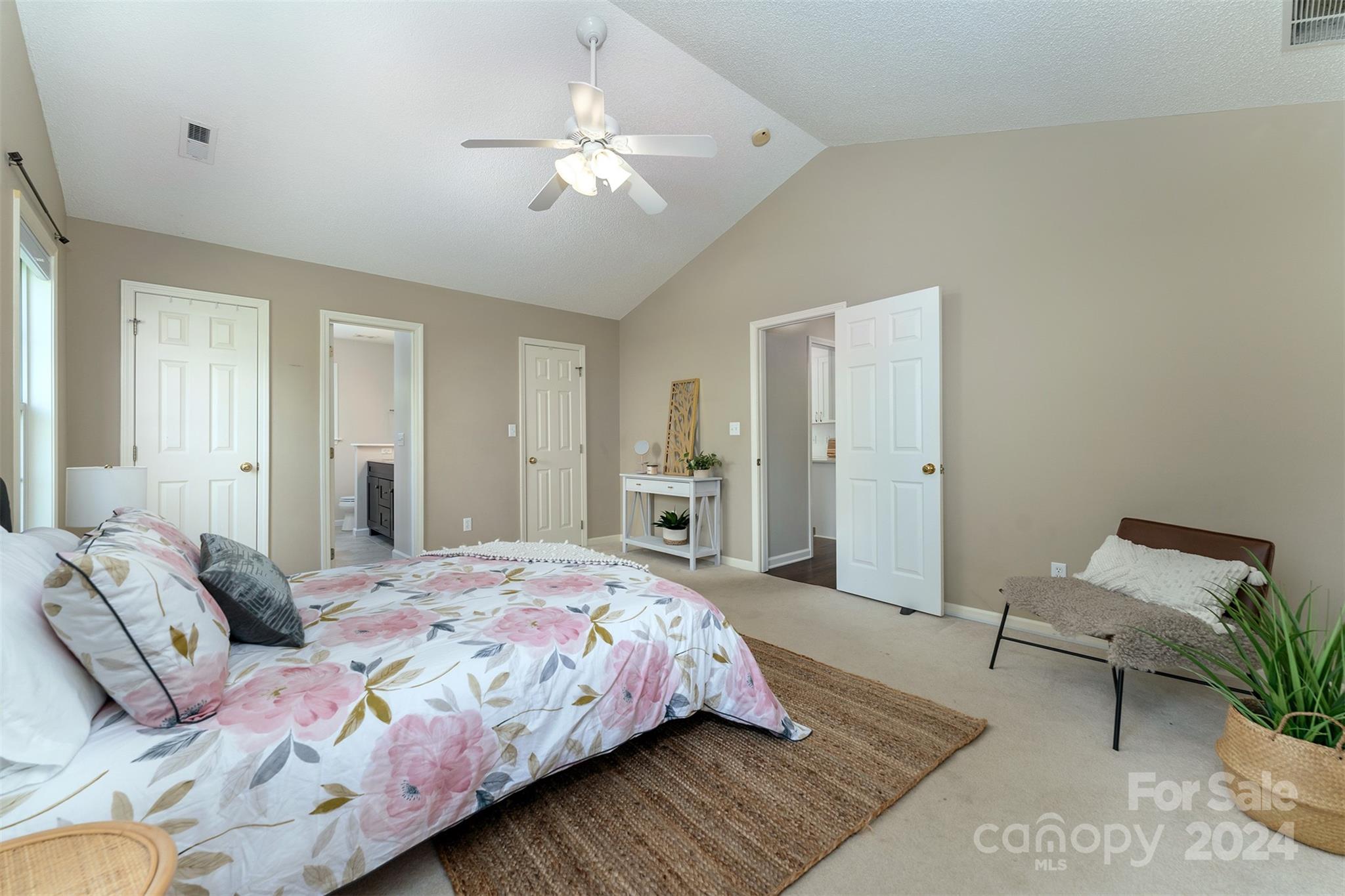311 Planters Creek Road Fletcher, NC 28732 - Photo 12 of 24 a bedroom with bed and a chandelier